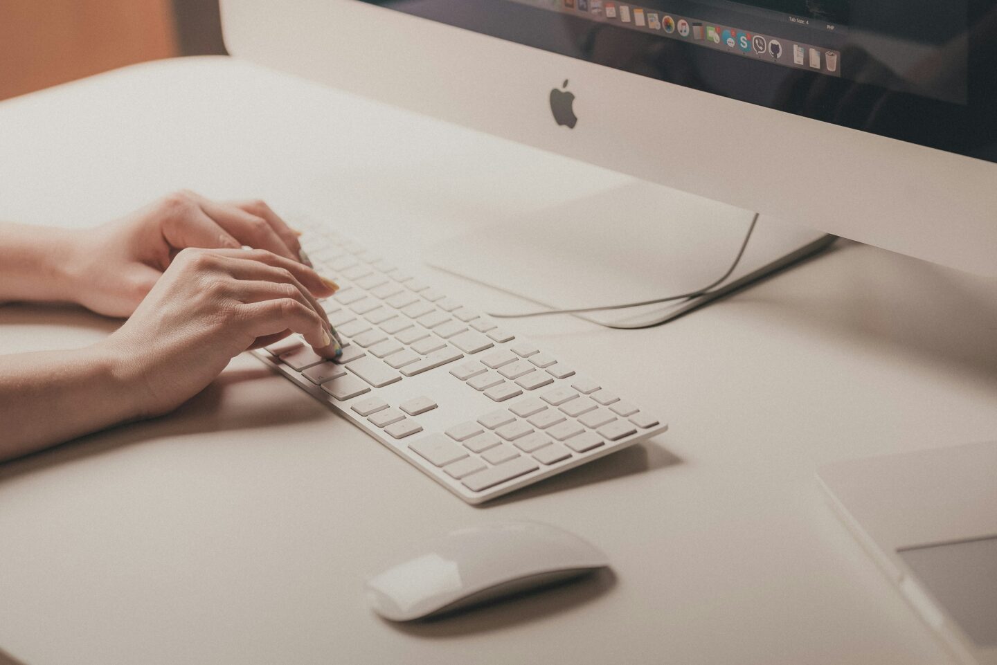 Entrepreneur typing on a keyboard in an office