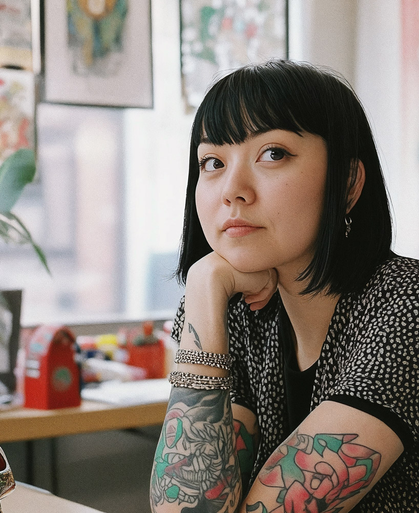 Photo of a tattoo artist in her workshop